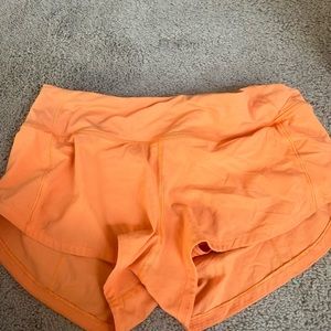 Orange lululemon speed ups size 4